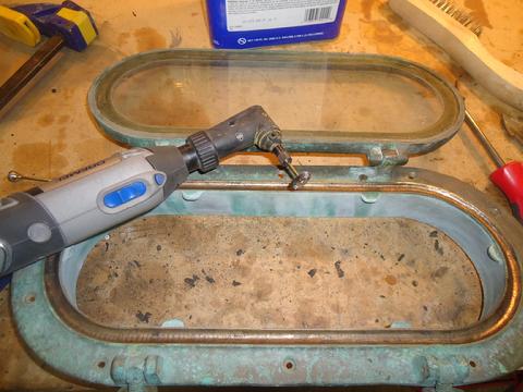 Using the Dremel with a wire wheel to clean up the gasket trough.