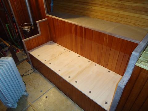 The mahogany cleats on the underside of the seat sit on the mahogany runners attached to inside of the seat box. Pull one seat up and set it on the others and t