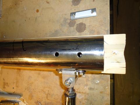 Drilling holes for the U brackets. Just above the HMT is the small pre tapped backing plate supplied by Cape Horn.