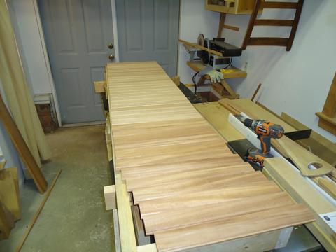 I had to mill some additional African Mahogany to finish off the quarter berth. In this photo it is laid out on the vertical panel that is sitting on top of a f