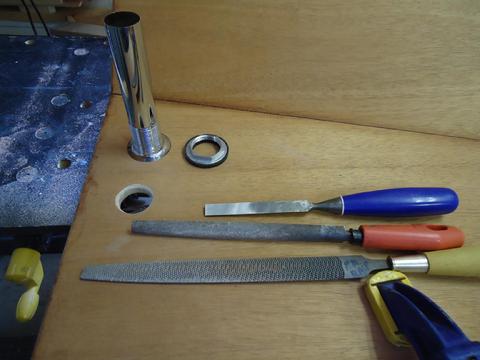 I used a 1 1/4" hole saw to drill the holes. I completed the fitting with these tools.