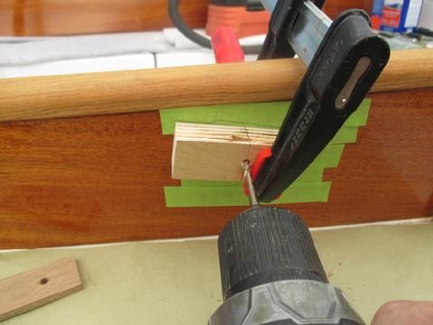 Then, I clamped on a home made drill guide to ensure I drilled the hole straight and square.