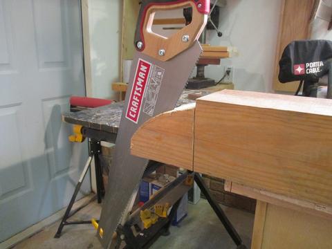 I trimed the cut out with a jig saw leaving plenty of room for blade wander. Then I cut outside vertical edges with a carpenter's saw.