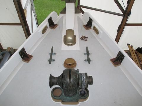 The cleats are not bedded in this photo but they are positioned. I decided not to use the chain pipe on the port side of the windlass and opted for a stand alon