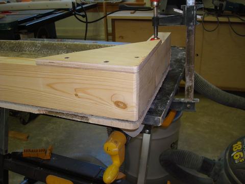 Then I built a jig that would allow me to lay the cloth along side and create the "lips." In this picture the jig and hatch or upside down. I will flip it over