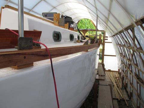 looking forward along the bulwark on the starboard side. There will be two bolts for each plank on every vertcial support plate.