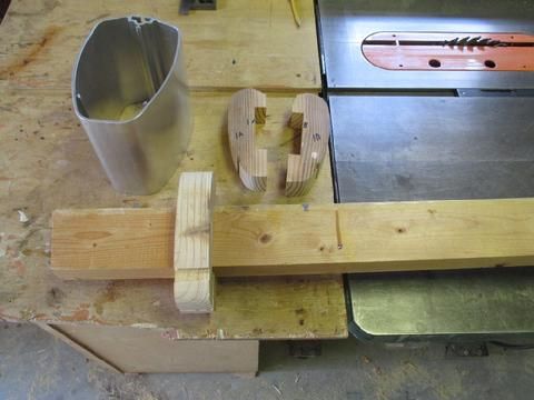 We needed to build a special holder to support the top end of the mast that has a section cut out for the mast head fitting. I epoxied the "yokes" to the 2x4.