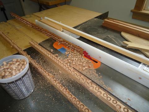 Cutting the plugs from the wood stock.