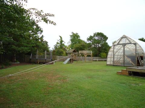 Guy lines in place. Trampoline and other furniture chained down.