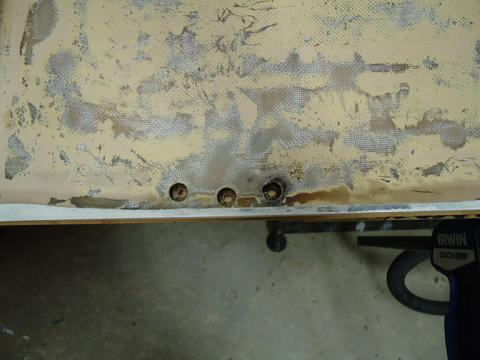 The holes drill out larger sized from the inside of the seat hatch lid.