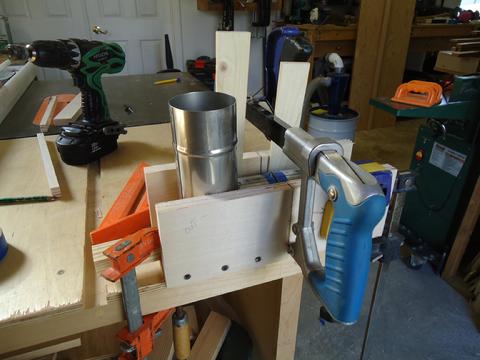 Task specific miter box--the cut is almost complete.