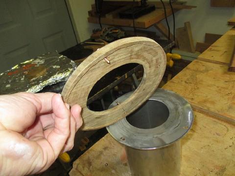 I mortised the underside of the teak trim to fit over the flange of the head shield.