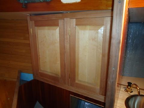 Cabinet doors in the forward cabin.