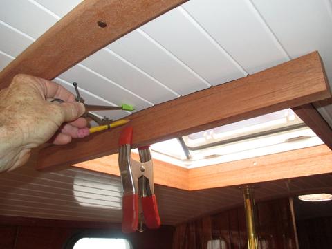 To cut a curve on the trim piece to match the overhead I used a standard scribing technique.