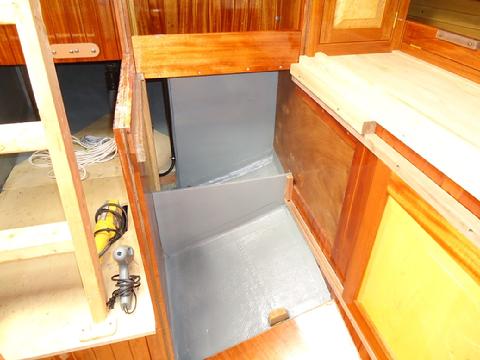 I applied a coat of grey Interlux Bilge-Kote to the area under the stove.