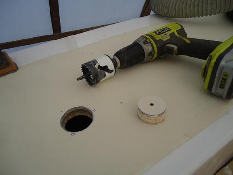 I drilled a 1 3/4" hole for the bronze water fill on the side deck above the fill port for the shower tank.