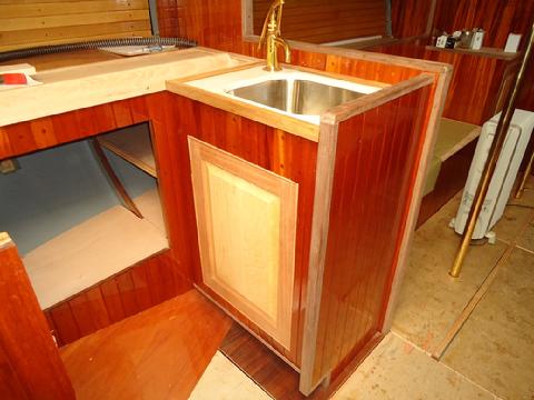 Cabinet door under the sink in the galley.