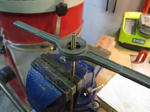 I fit the handle over the die. I make short turns and after each foward turn to the right, I back up 1/8th of a turn to clear the shavings from the die. I use c