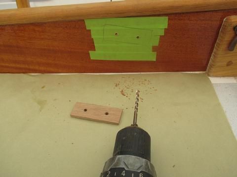 I made a little jig to ensure I had the right spacing for the fastener holes. I only drilled in to the mahogany about 1/8" -- just enough to mark the holes.