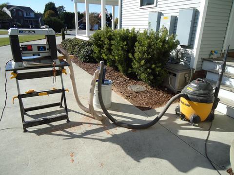 The mini-cyclone dust collection system hooked up to the planer.