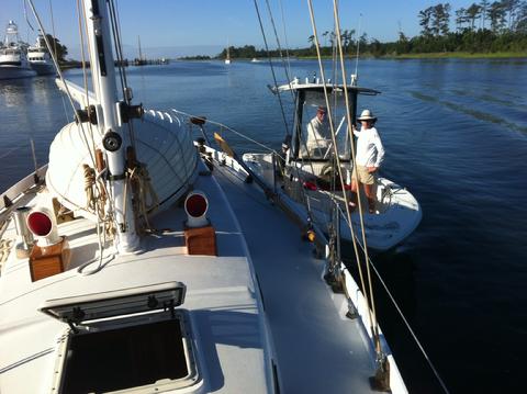 The Far Reach being hip towed north on Adams Creek. That's Tricia and Wave in the skiff.