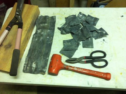 I hammered the lead sheets flat then cut them into small sections with the garden sheers and tin snips.