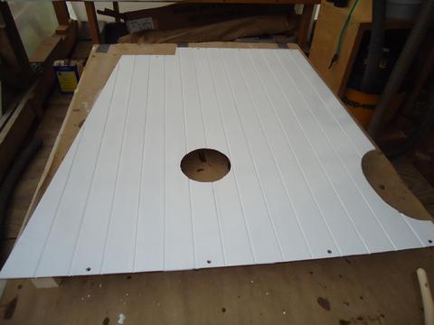 The first coat of primer, rolled and tipped.