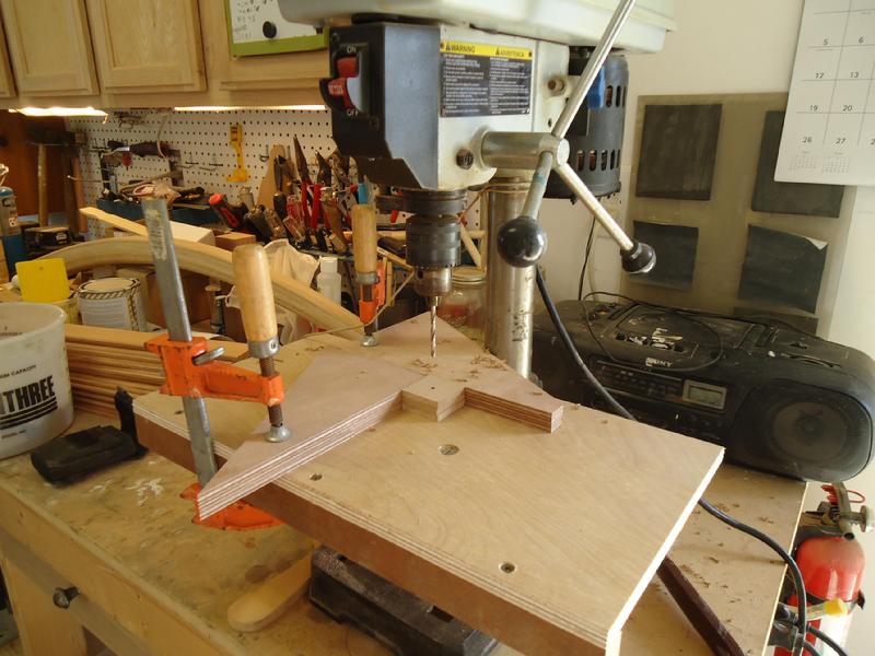 Drilling oversize holes in the MDF backing blocks.