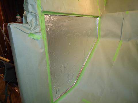 I masked off the area to spray the contact cement on the bulkhead. I applied two layer of aluminum foil.