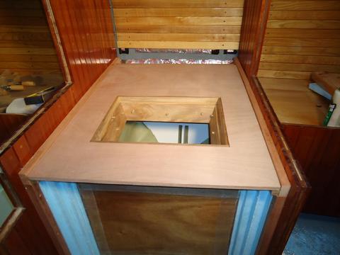 Test fitting the top. The hinged ash counter top will fit over the plywood top.