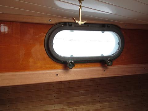 This is the most forward portlight. It's in the fwd cabin. You can see there is about 3/8" between the overhead and the portlight. The portlight tilts up a litt