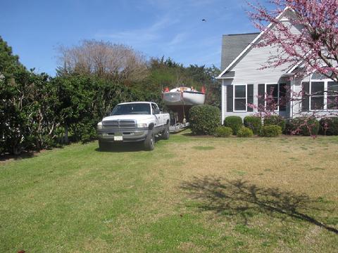 Steve used his Dodge diesel pick up to pull the trailer around to the stret. Then he switched to the big tractor to haul the trailer to the boat yard.