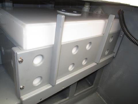 The 20 gallon dedicated shower tank locatedin the port cockpit locker. It has an on-deck fill.