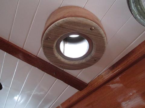 The flue will pass through the hole and fit into the deck plate and smoke head.