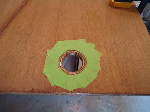 I taped the hole and applied a couple of unthickened coats of epoxy.