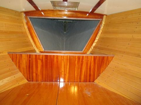 I installed the walnut trim on the top edge of the chain locker and around the opening of the rope locker behind it.