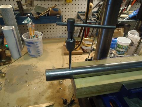 Tapping the trheads into the stanchion base.