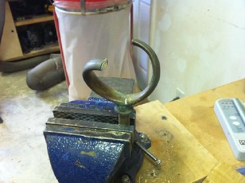 I bent the oar lock diagonally in the vise. I did not heat it up but worked it cold.