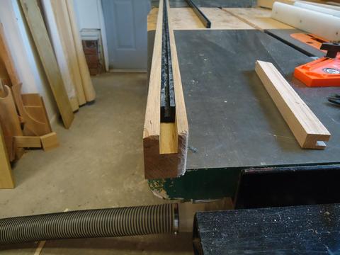 Test fitting the UHMW in the 3/4" wide dado cut in the teak rail. The dado in the UHMC is 1/4" wide.