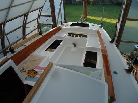 The coaming makes the cockpit look larger.