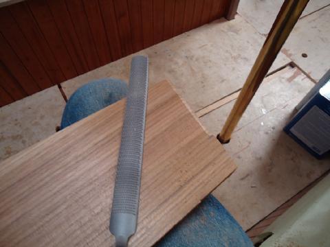 I used a cabinet maker's rasp to file a radiused edge to match the inside corner where the trim fits.