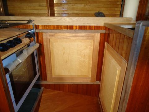 The door slides great. I will install the wood plugs in the rails after the door is varnished and reinstalled.