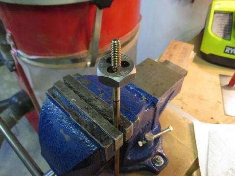 I marked on the bolts shaft how far I wanted the threads to extend. Then, I clamped the bolt firmly in the vise and spun the die on to the threads.