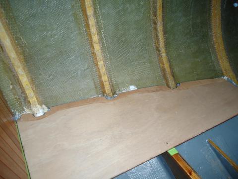 The bottom of the q-berth locker. Note where I power planed the edge for the tape to lay flush.