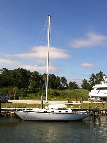 Finally in her element. She is absolutly bone dry--neither water in the tanks nor stores or equipment on board. She is a little down at the bow--maybe an inch o