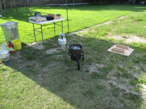 We set up in the backyard in the shade of a portable canopy. We used the space the boat shed had been located for the actual casting of the lead.