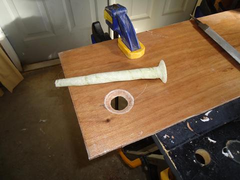 I used a chisel and a file to bevel the hole to accomadate the drain flange.