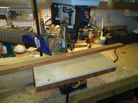 Cutting plugs with a 3/8" tapered plug cutter. The hose to the left of the drill goes to the dust collector.