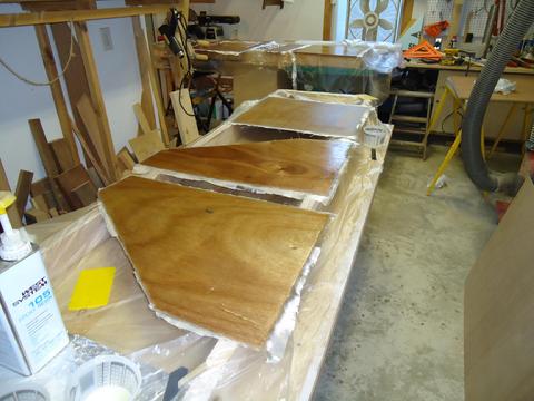 I applied 10oz cloth to both sides. The bottom and angled sides received three layers of cloth on the inside surfaces.